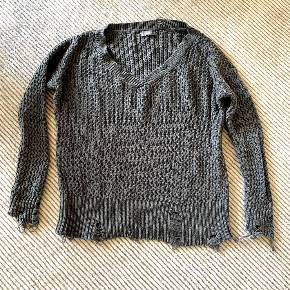 Distressed cotton sweater